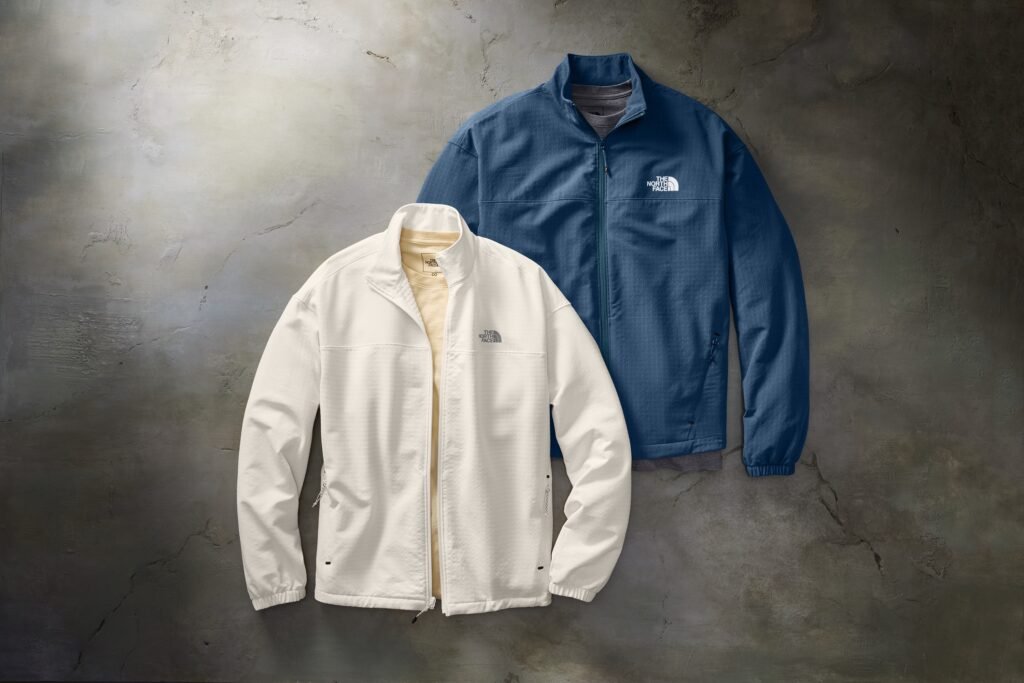 Cream jacket with embroidered logo on hanger